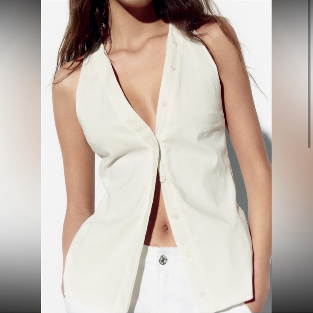 White Zara linen blend halter top with button closure and open back.